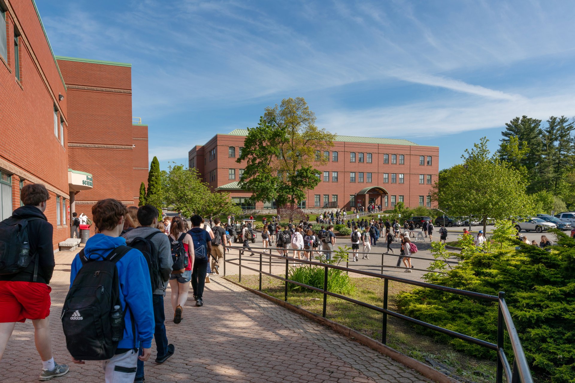 Students walking on campus near the Bradford V. Ek Science Building.