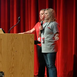 Two staff members standing at a podium in the Stockbridge.